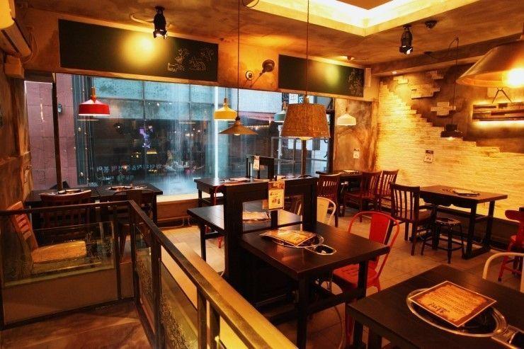 Charming restaurant interior at Hwa Tteok, featuring a cozy-elegant vibe perfect for casual dining in Seoul's Myeongdong.